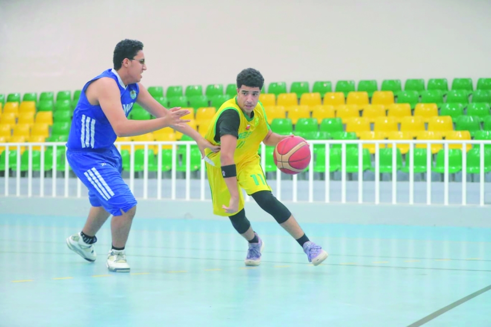 Al Seeb player controls the ball.