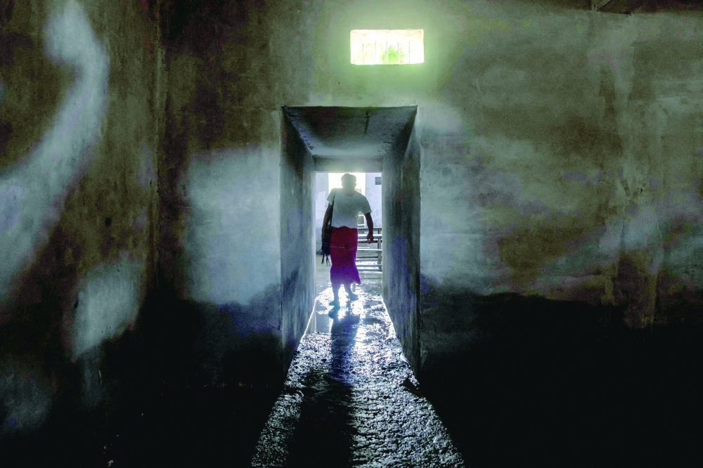 Students walking into a classroom in a concrete bunker to protect against air strikes at a village in the Sagaing region.  - AFP