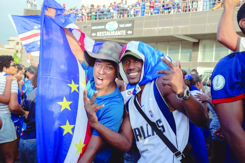 Supporters celebrate Cape Verde's victory against Eswatini during the Fifa World Cup 2026 Africa qualifiers group D match at a fan zone in Sao Vicente, Cape Verde. — AFP