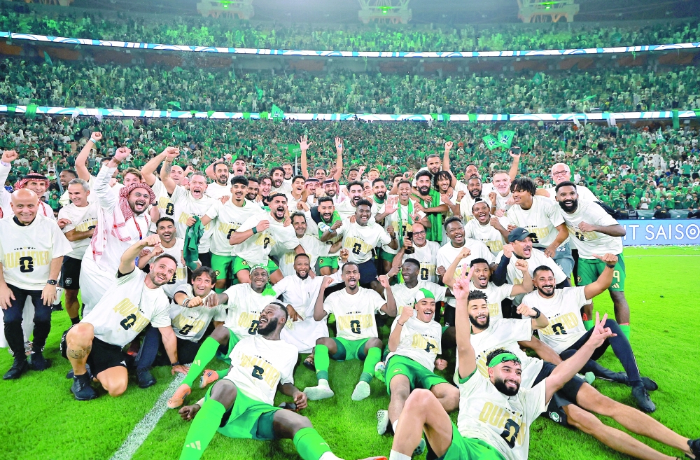 Saudi Arabia players celebrate after qualifying for the Fifa World Cup. — Reuters