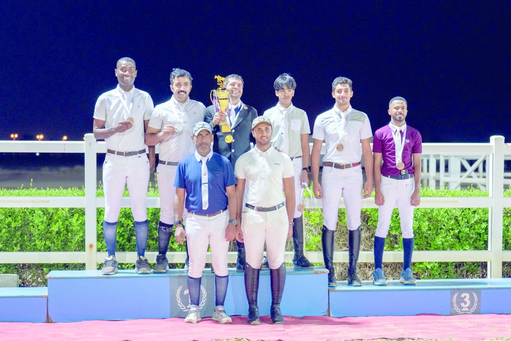 Medal winners pose on the podium.