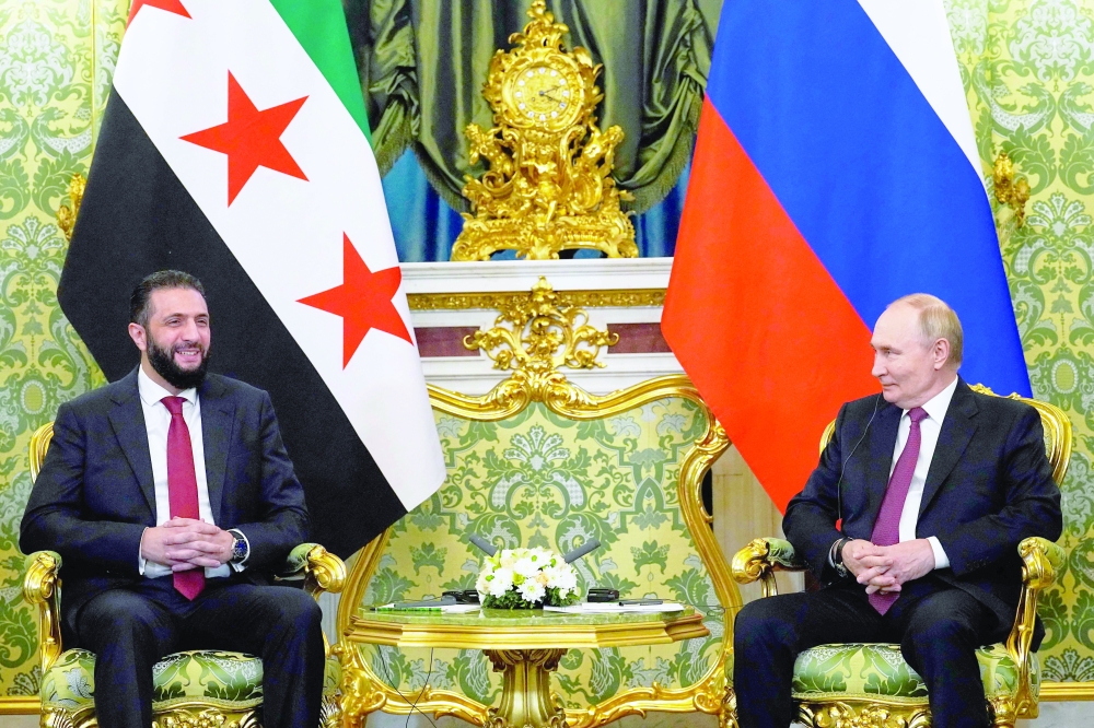 Russian President Vladimir Putin and Syrian president Ahmed al Sharaa hold a meeting at the Grand Kremlin Palace in Moscow. — AFP