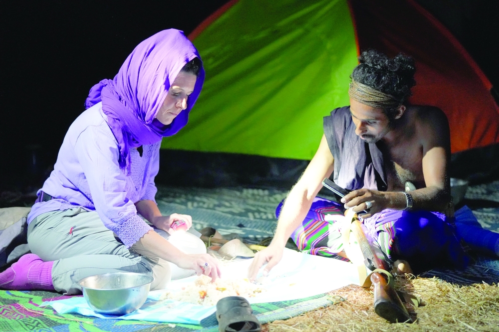 Nora Schweitzer eats tribal food