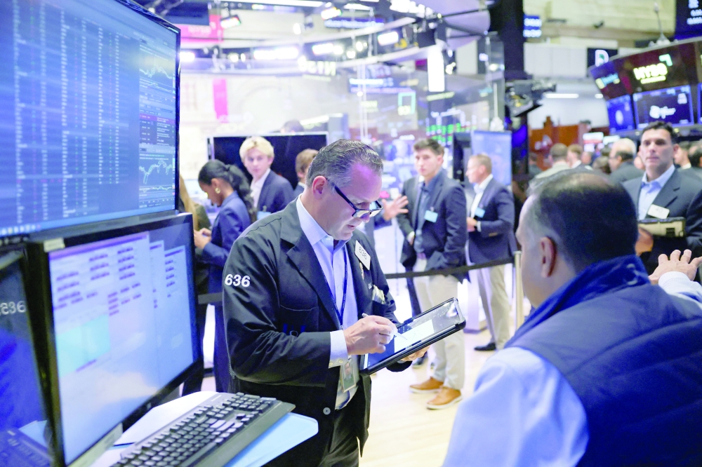 Traders work on the floor at the New York Stock Exchange (NYSE) in New York City. — Reuters