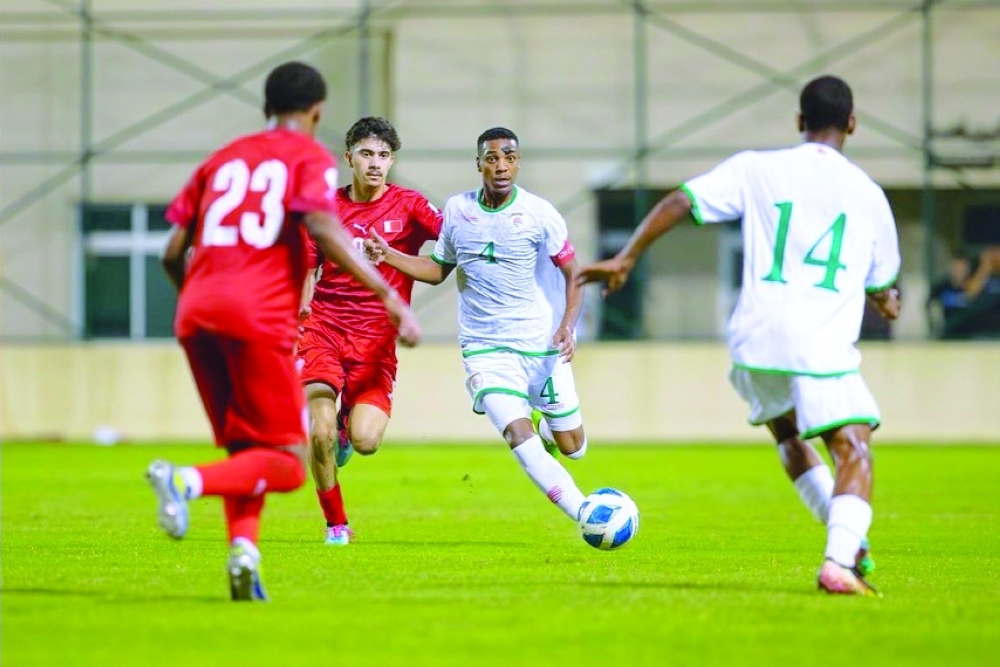 Oman and Bahrain players in action.