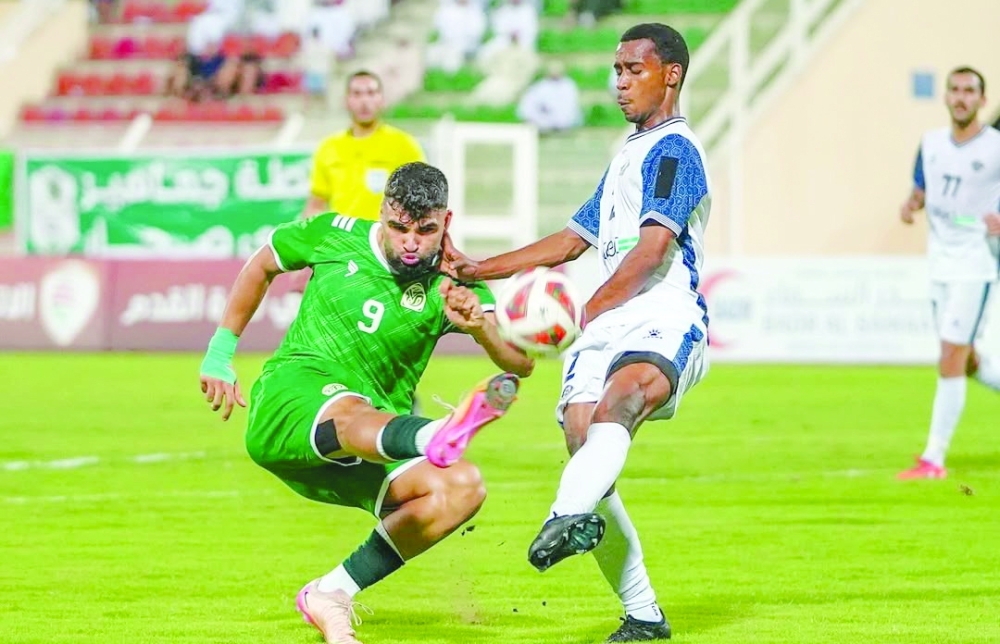 Sohar and Al Shabab players fight for the ball.