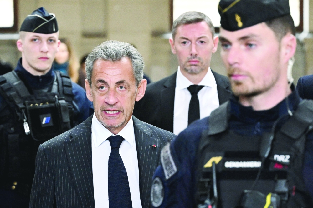 France's ex-president Nicolas Sarkozy arrives for the verdict in his appeal trial at the courthouse, in Paris. — AFP file photo