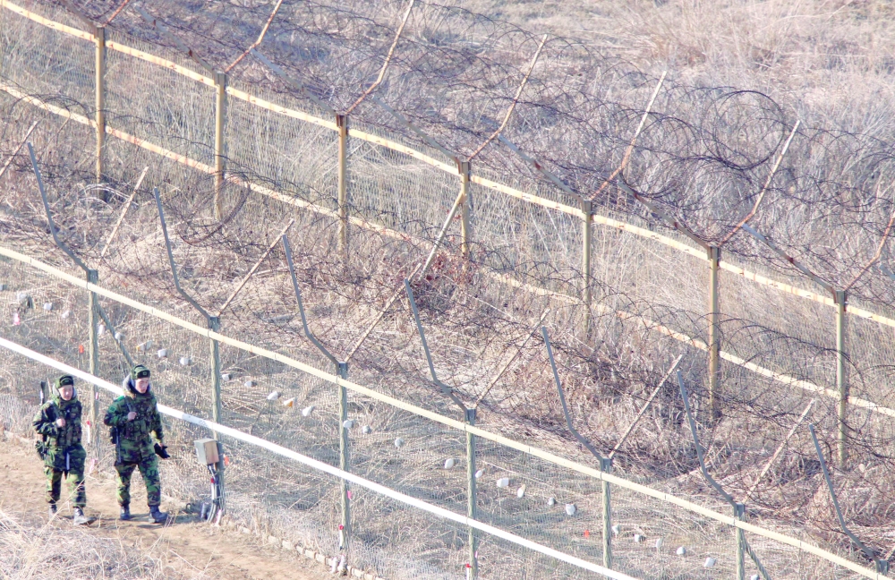 South Korean soldiers patrol near the demilitarized zone, in Goseong. — Reuters