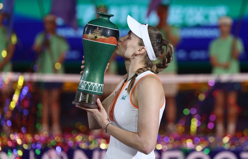 Kazakhstan's Elena Rybakina celebrates with the trophy. — Reuters