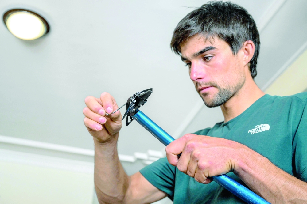 French mountaineer Benjamin Vedrines sorts his climbing gear in Kathmandu. — AFP