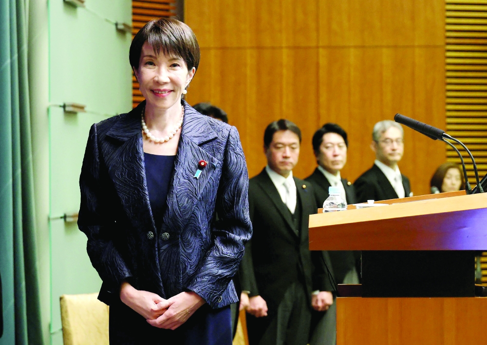 Japan's new Prime Minister Sanae Takaichi poses for photos, at the prime minister's office in Tokyo. — AFP