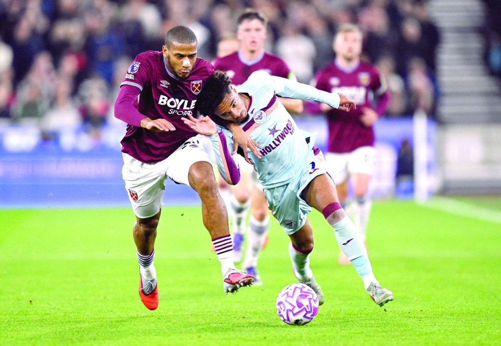 Brentford's Kevin Schade in action with West Ham United's Jean-Clair Todibo. — Reuters