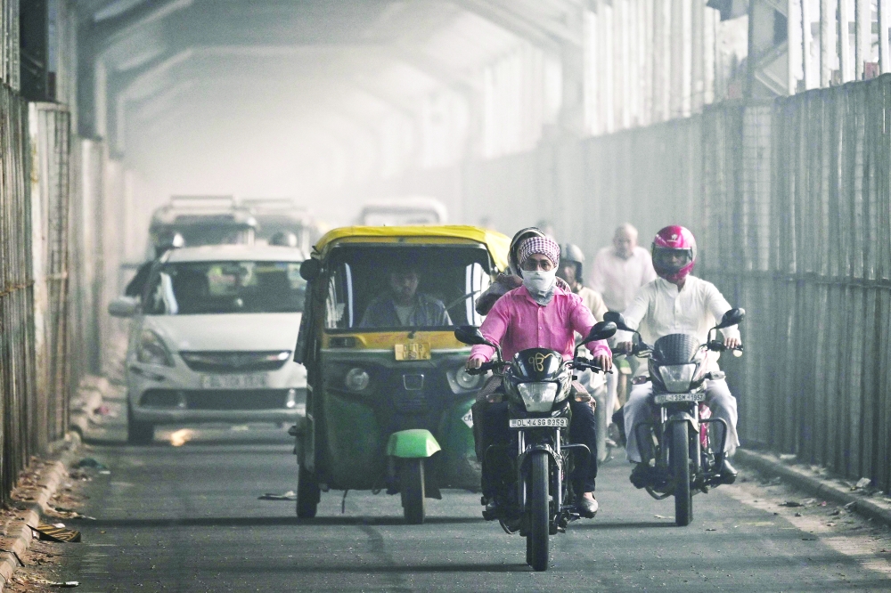 A commuter with his face covered