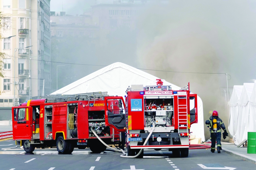 Firefighters work to extinguish a fire