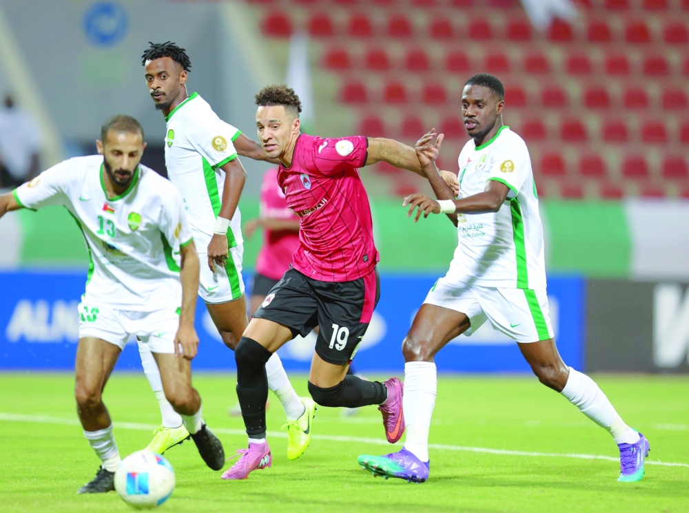 Players of Oman's Al Nahda and Qatar's Al Rayyan in action in Muscat.