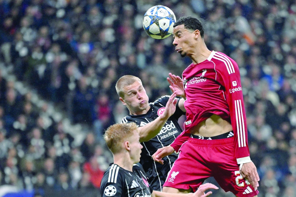 (R-L) Liverpool's French striker #22 Hugo Ekitike, Frankfurt's Danish defender #13 Rasmus Kristensen and Frankfurt's Swedish midfielder #16 Hugo Larsson vie for the ball during the UEFA Champions League football match between Eintracht Frankfurt and Liverpool FC. — AFP