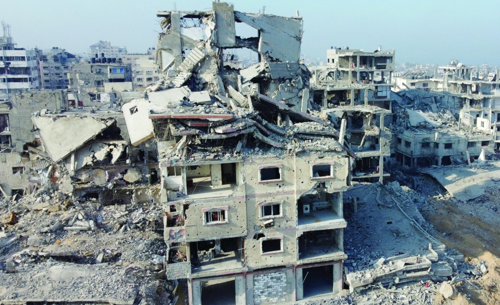 A drone view shows the destruction in a residential neighbourhood, after the withdrawal of the Israeli forces from the area, in Gaza on Friday. — AFP