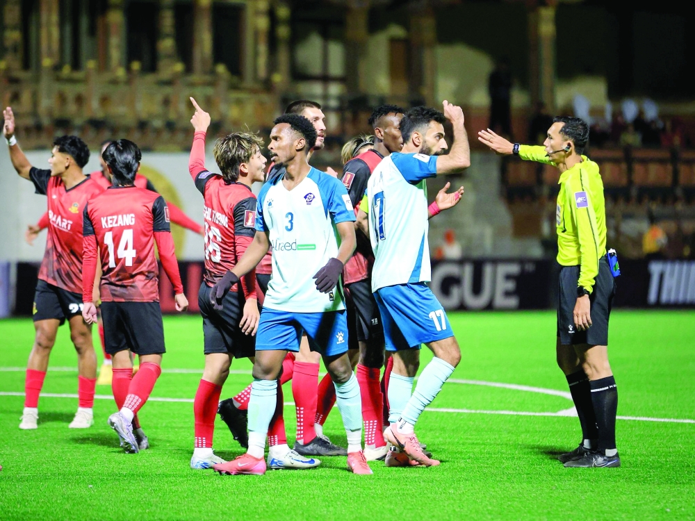 Al Shabab players celebrate after scoring the goal. 