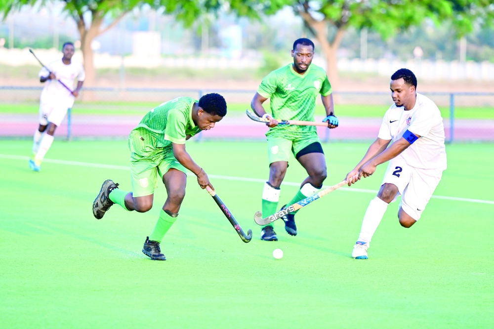 Al Ittihad and Mirbat players in action.