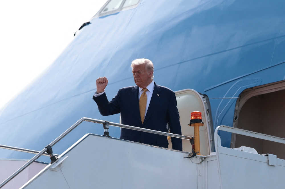 U.S. President Trump boards Air Force One as he departs for Japan at Kuala Lumpur International Airport