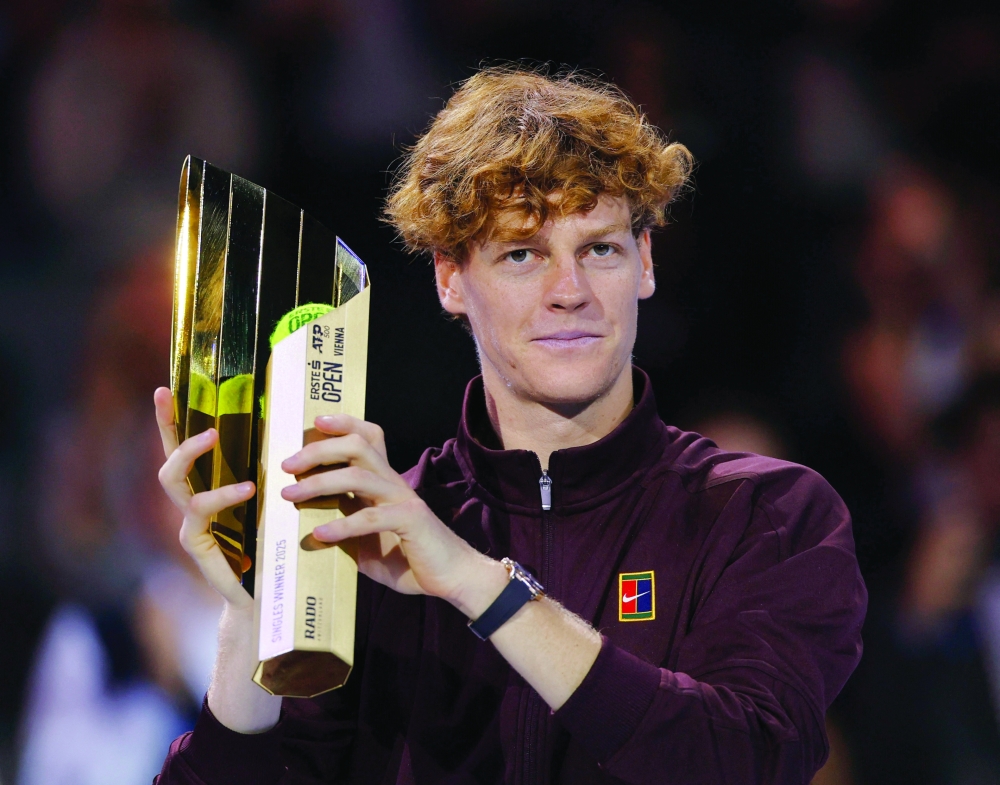 Italy's Jannik Sinner celebrates with the trophy. — Reuters