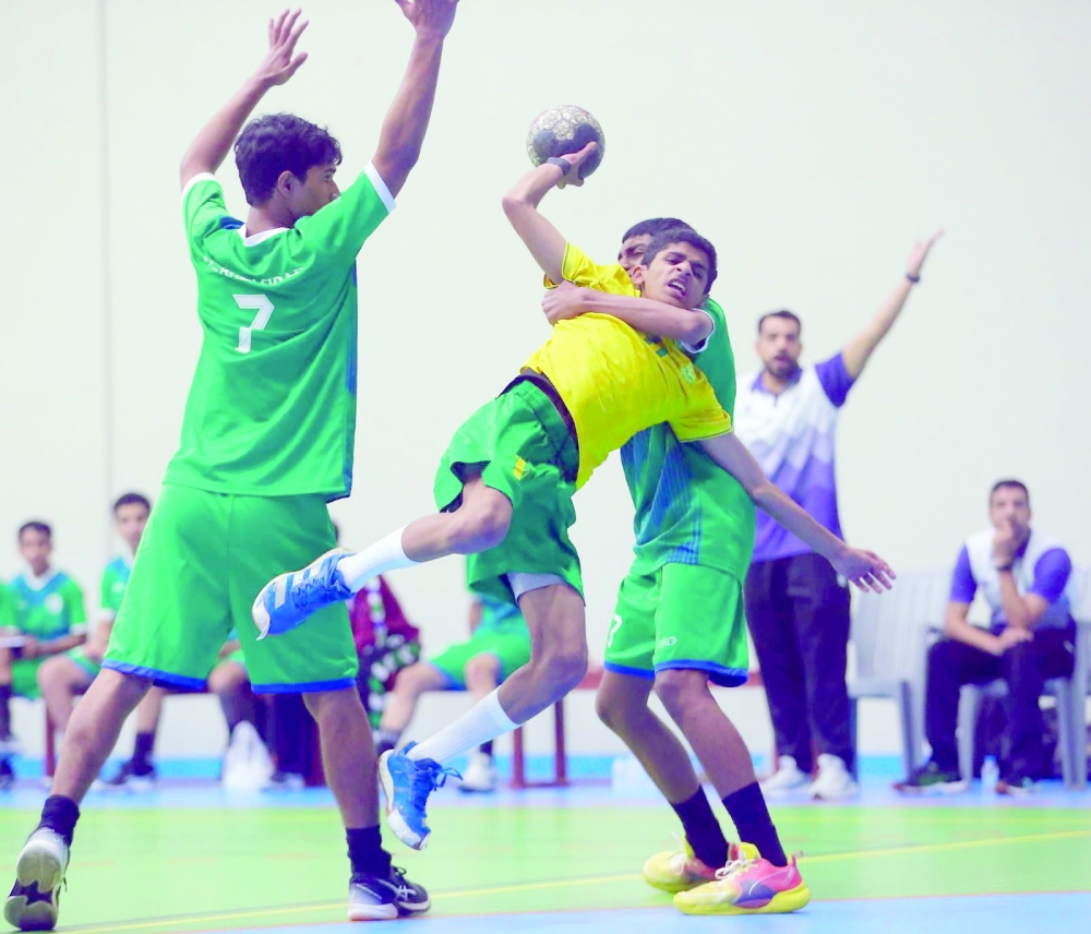 Seeb player aims towards Ahli Sidab goal.