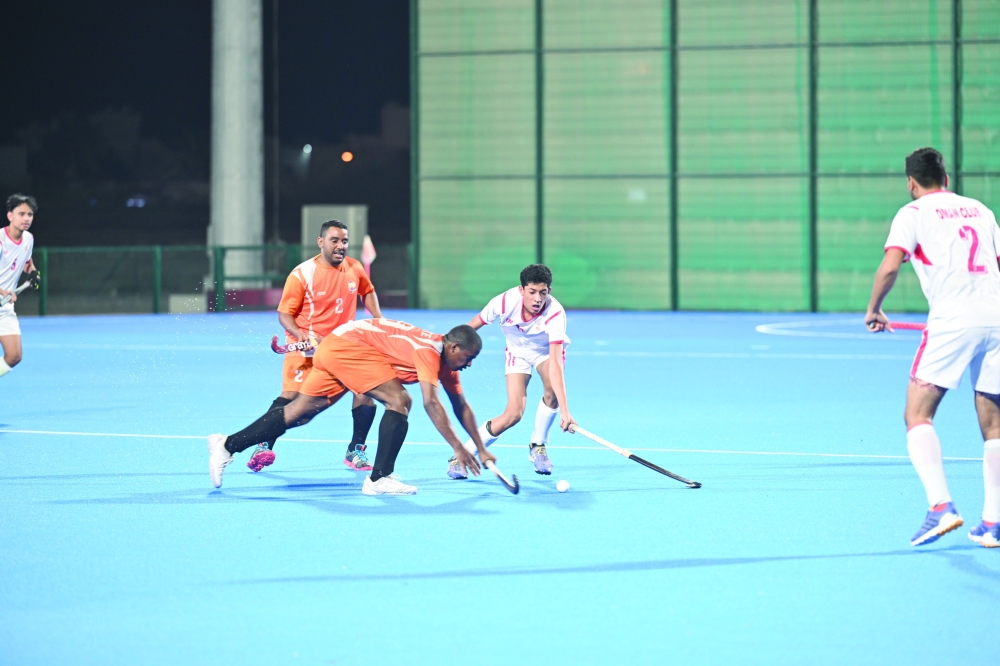 Qurayat and Oman Club players in action at Hockey Oman Stadium. — Khalfan al Ruzaiqi