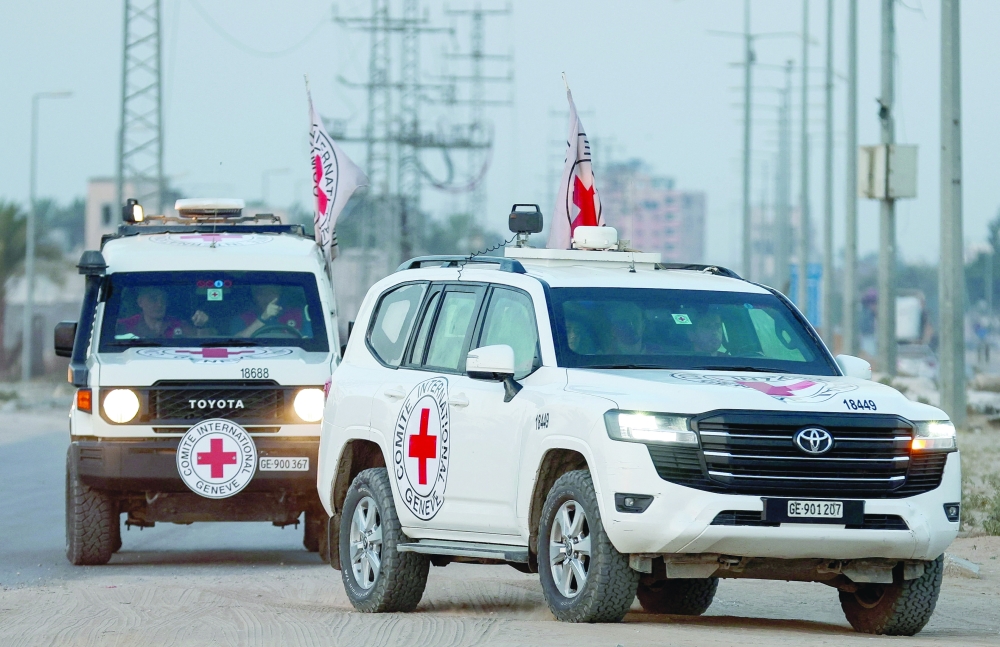 The Red Cross transports the body of a deceased captive after it was handed over by Hamas in Deir Al Balah, in the central Gaza Strip, on Thursday. - Reuters