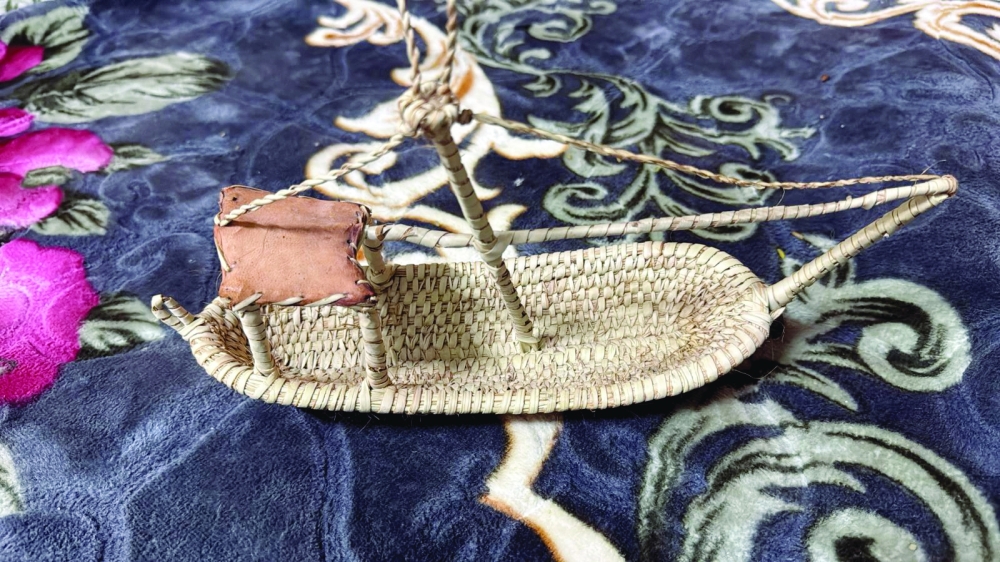A ship handcrafted from date palm fronds