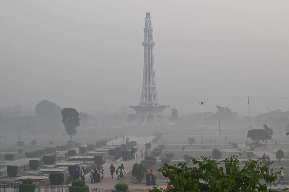  People visit a park amid heavy smoggy conditions in Lahore 