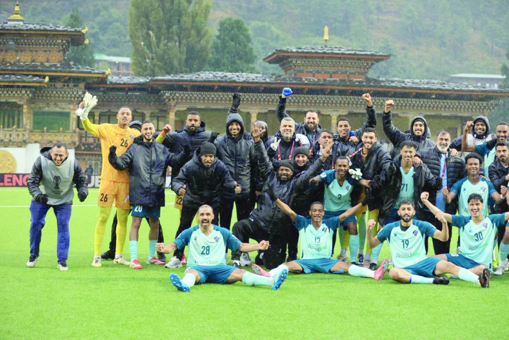 Al Shabab players celebrate after the match.