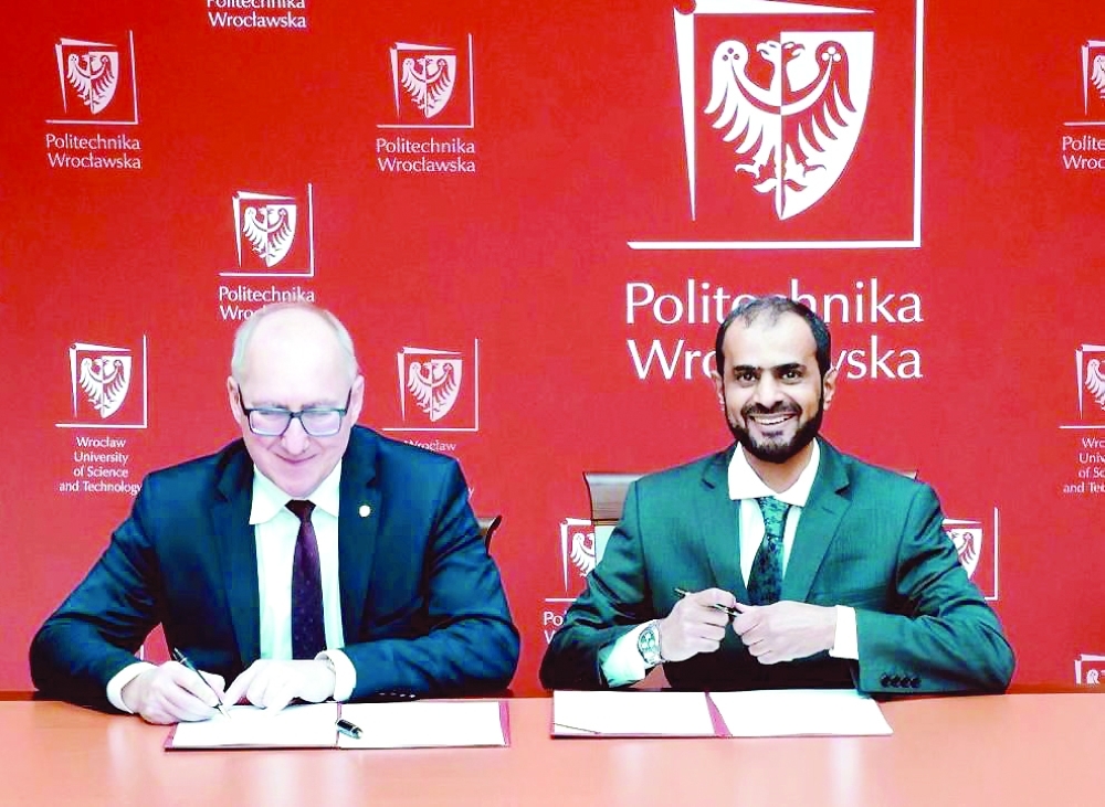 Officials from ETCO Space and Wrocław University of Science and Technology at the signing in Poland.