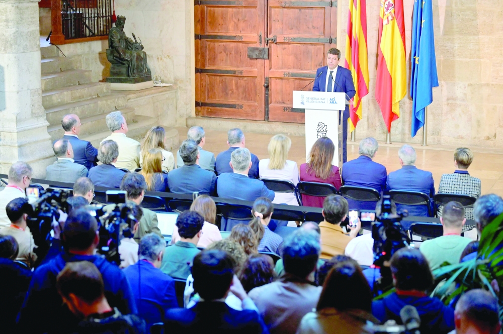 Carlos Mazon gives a press conference to announce his resignation at Valencia's Palau de la Generalitat. — AFP