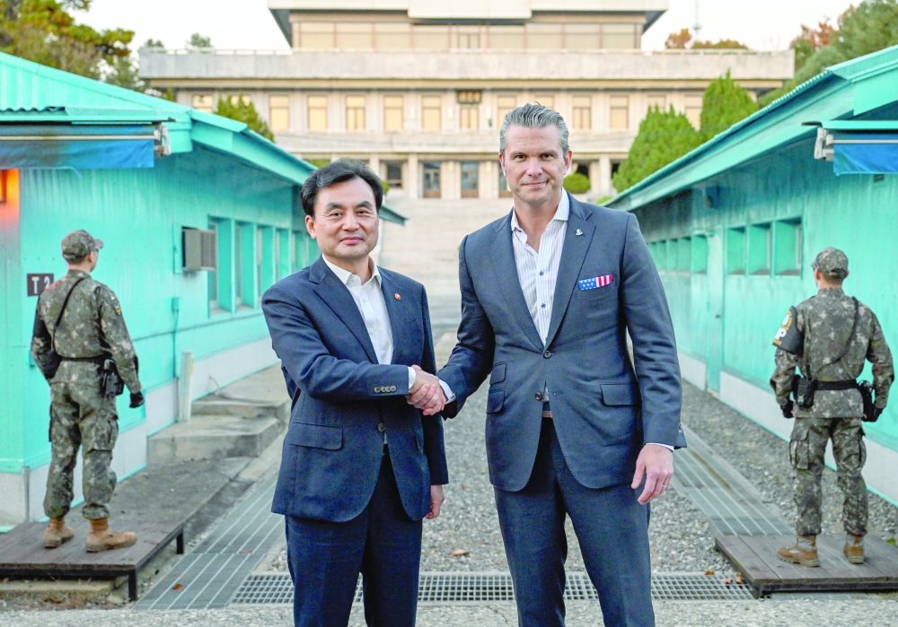 US Defence Secretary Pete Hegseth shakes hands with South Korea's Defence Minister Ahn Gyu-back, in Paju, South Korea. — Reuters