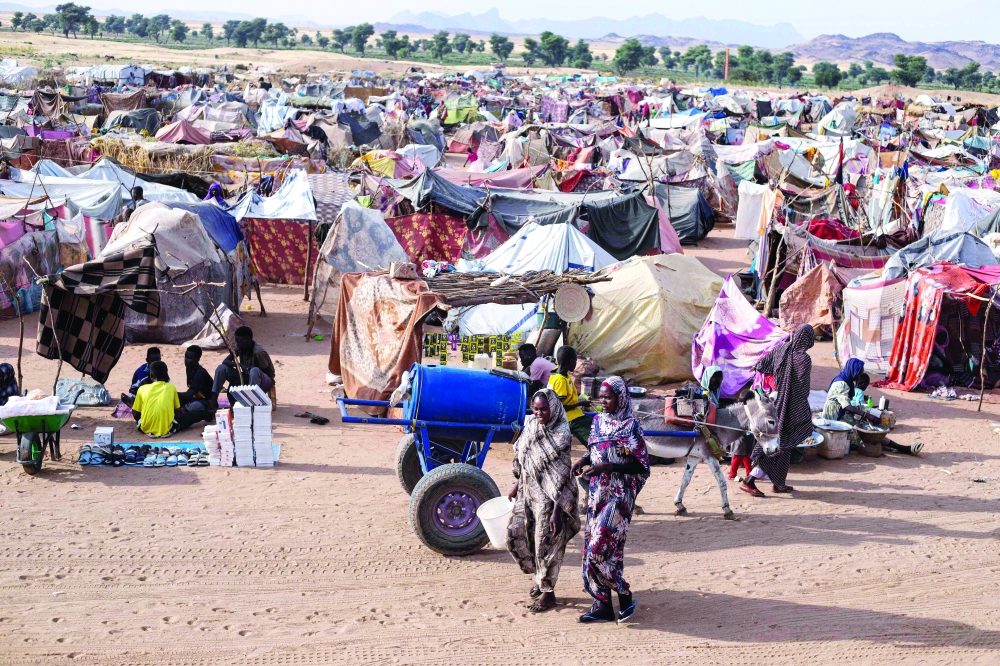 Displaced Sudanese rest in the camp of Um Yanqur, in Sudan's western Darfur. — AFP