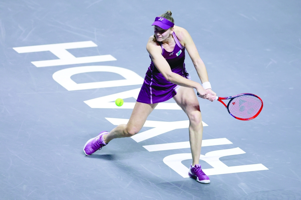 Kazakhstan's Elena Rybakina in action during her group stage match against Poland's Iga Swiatek. — Reuters