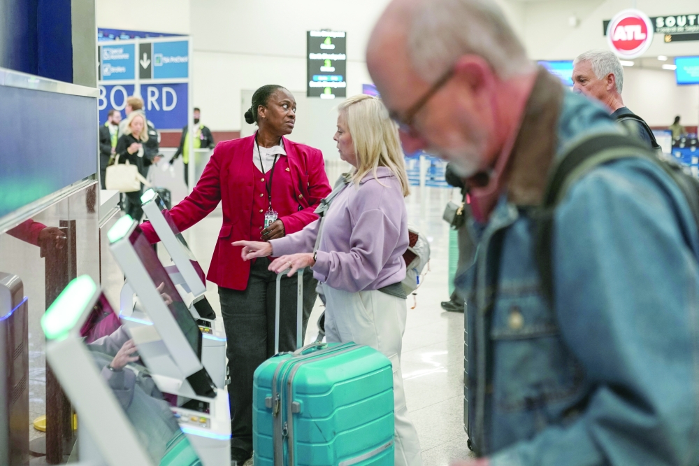 Air travellers face the commute at Hartsfield-Jackson Atlanta International Airport, a day after US Transportation Secretary Sean Duffy said that he would order 10 per cent of flights at 40 major US airports to be cut starting on Friday unless a deal to end the federal government shutdown is reached, in Atlanta, Georgia. — Reuters