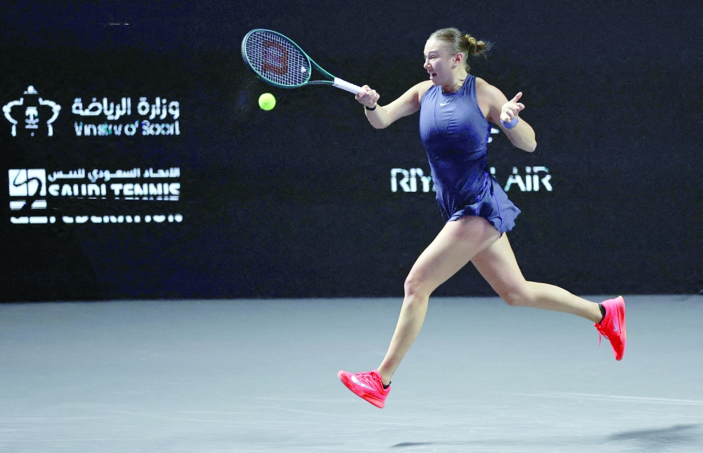 Amanda Anisimova of the US in action during her group stage match against Poland's Iga Swiatek. — Reuters
