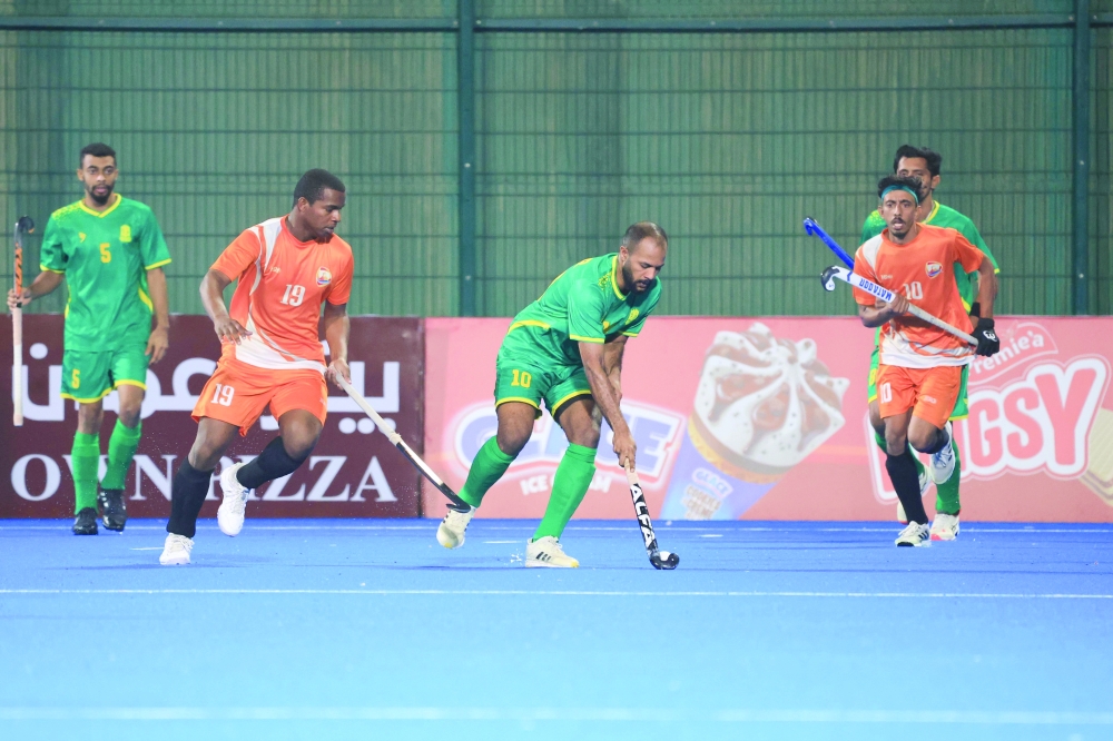Qurayat and Seeb players in action at the Hockey Oman Stadium in Al Amerat.