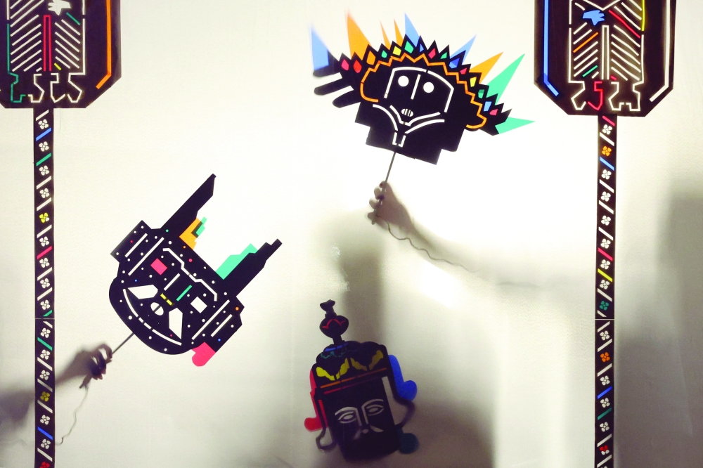 Iranian artists perform a shadow puppet theater at a toys museum. — AFP 