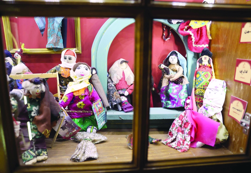Dolls are displayed at a toy museum