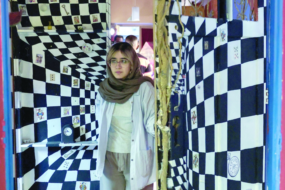 A visitor looks at items displayed at a toy museum.