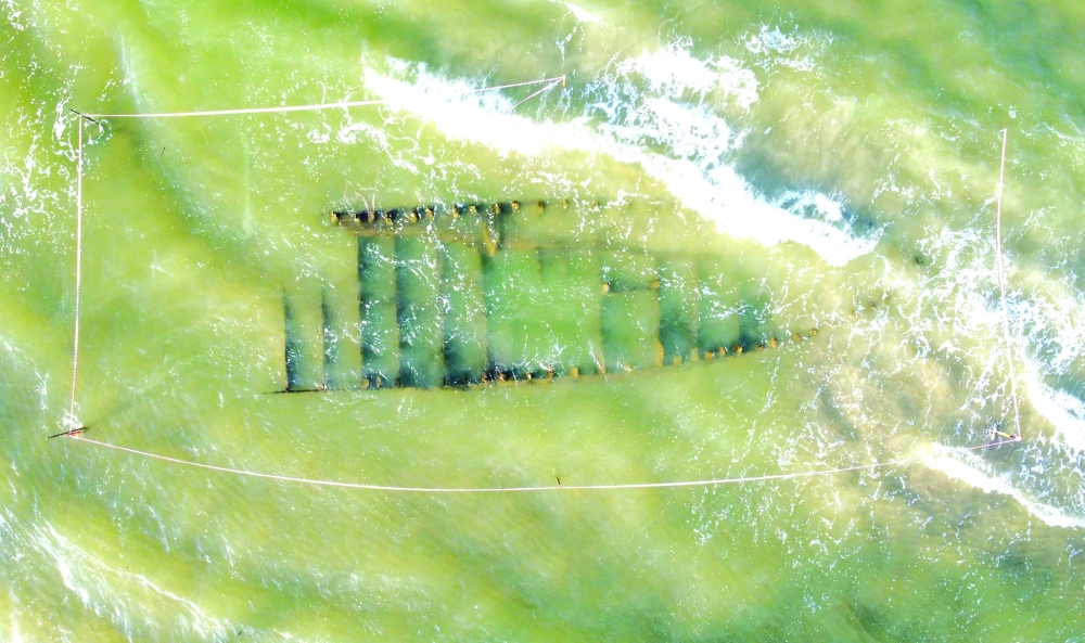 A centuries-old shipwreck uncovered in the aftermath of Typhoon Kalmaegi on a beach off the Hoi An coast in central Vietnam. —  AFP