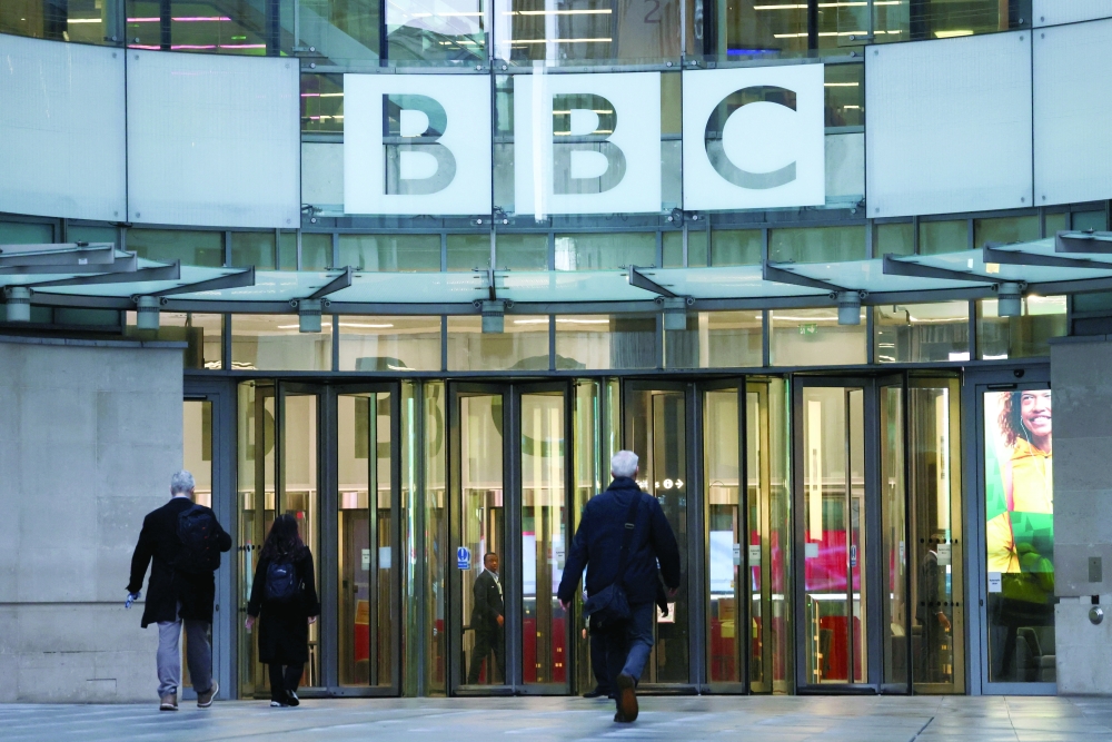 People walk outside BBC Broadcasting House, in London. — Reuters 
