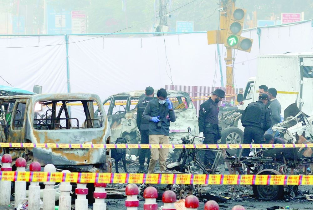 Security personnel work at the site of an explosion, in the old quarters of Delhi. — Reuters