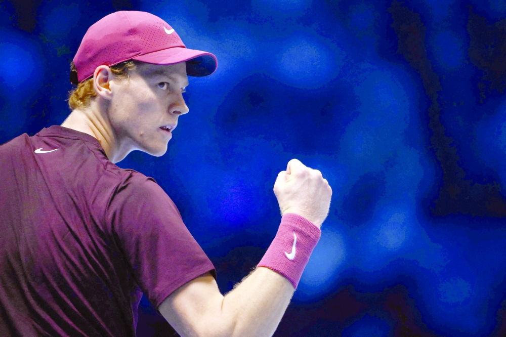 Italy's Jannik Sinner reacts during his match against Canada's Felix Auger-Aliassime at the ATP Finals tennis tournament in Turin on November 10, 2025. (Photo by Marco BERTORELLO / AFP)
