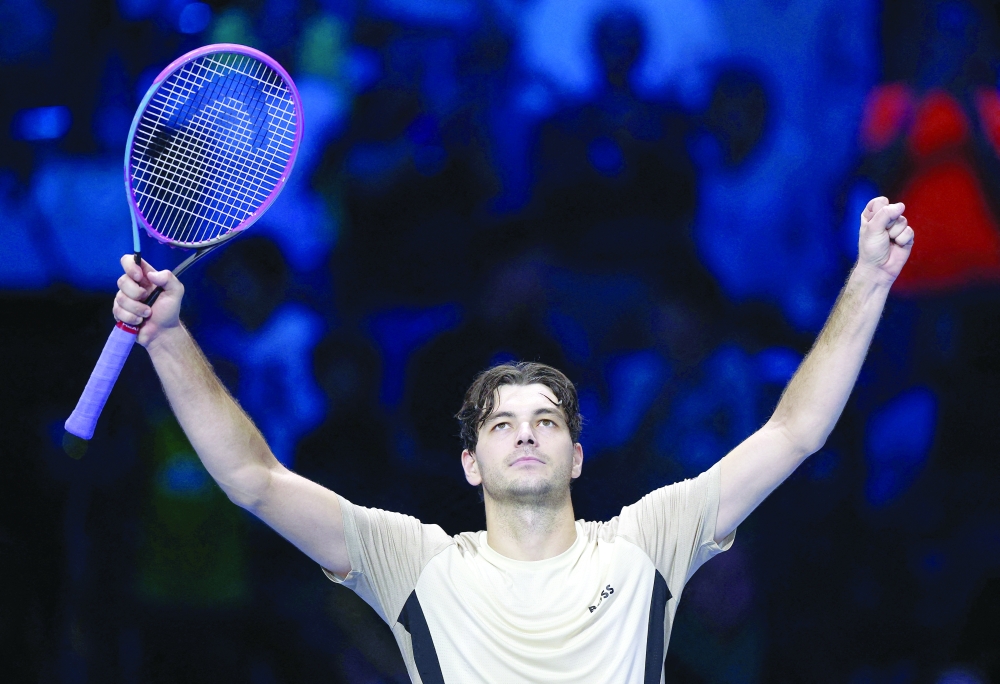 Tennis - ATP Finals - Turin - Palasport Olimpico, Turin, Italy - November 10, 2025 Taylor Fritz of the U.S.  celebrates after winning his round robin match against Italy's Lorenzo Musetti REUTERS/Guglielmo Mangiapane