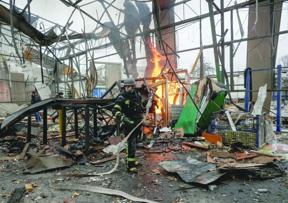 A firefighter works at the site of a Russian drone strike, in Kharkiv, Ukraine. — Reuters