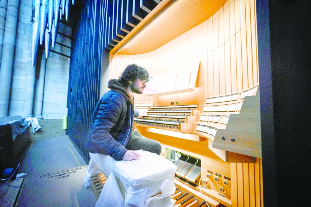 Pipes chief intoner Andre Lacroix tuning the new organ in St Vitus Cathedral at Prague Castle, Czech Republic. — AFP 