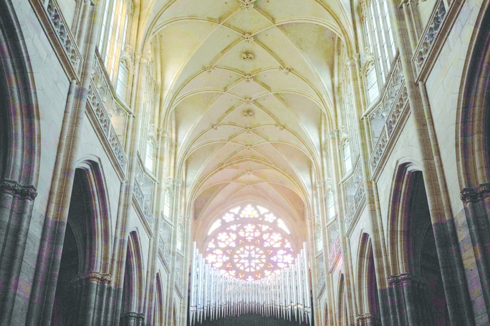 This photo taken on November 5, 2025 shows pipes (background, in front of the rosette) of the new organ in St Vitus Cathedral at Prague Castle, Czech Republic. Prague's iconic St. Vitus cathedral, the highlight of postcards from the Czech capital, will get a long-awaited new organ befitting its Gothic splendour and due to be inaugurated in 2026. Located in Prague's UNESCO-listed historic centre, the landmark cathedral, whose construction spanned from 1344 to the early 20th century, has already housed a dozen organs. (Photo by Michal Cizek / AFP)